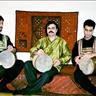 Figure 3: The tombak players of the Zarbang Ensemble from left to right: Behnam Samani, Pejman Hadadi, and Reza Samani